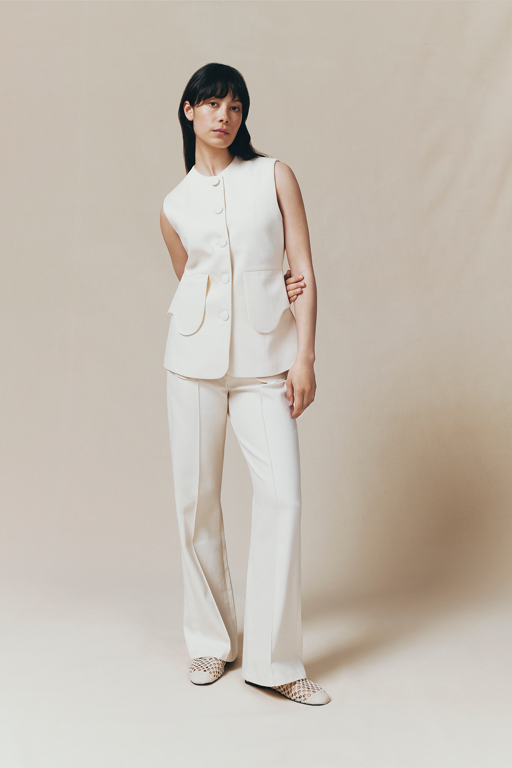 Denim ecru flared pants with circular pocket details