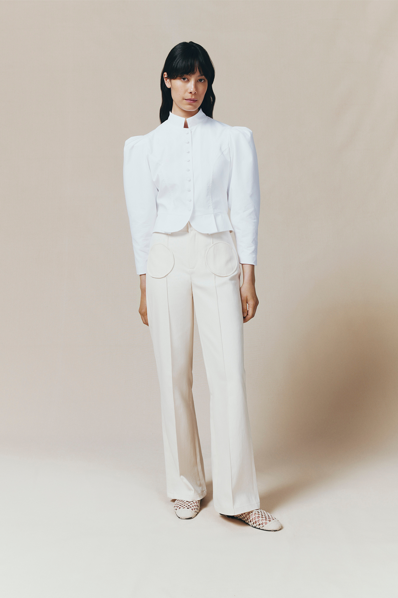 Denim ecru flared pants with circular pocket details